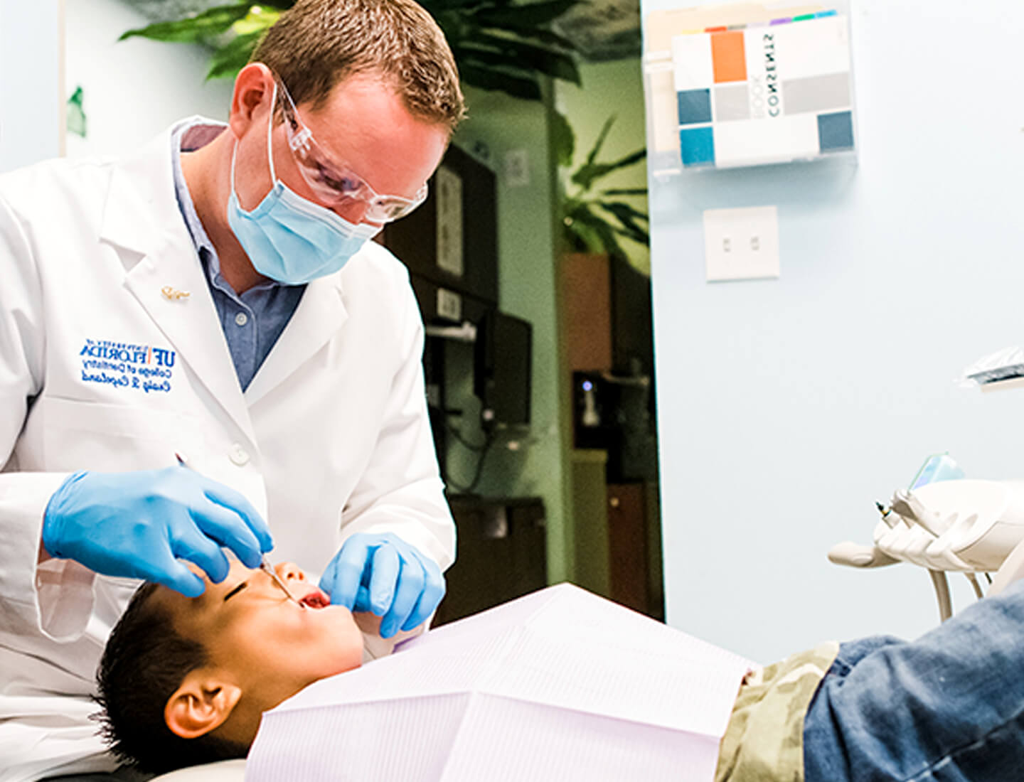 Doctor working on young patient.